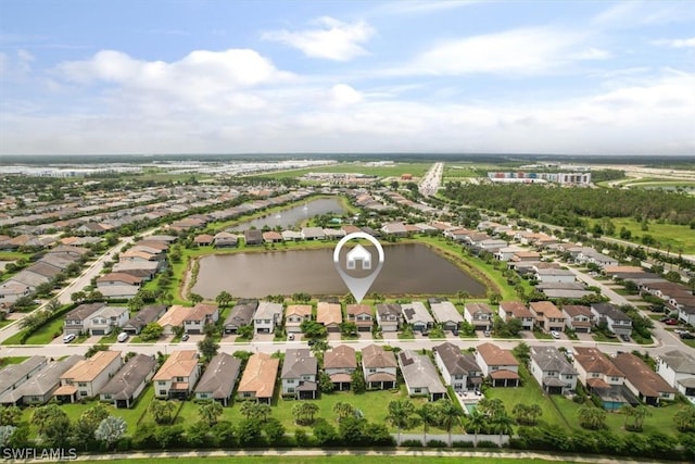 bird's eye view featuring a water view and a residential view