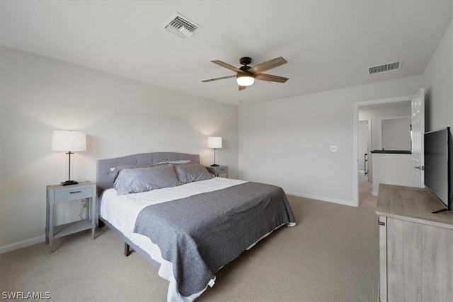 bedroom featuring light colored carpet, visible vents, and baseboards