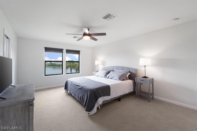 bedroom with carpet flooring, visible vents, and baseboards