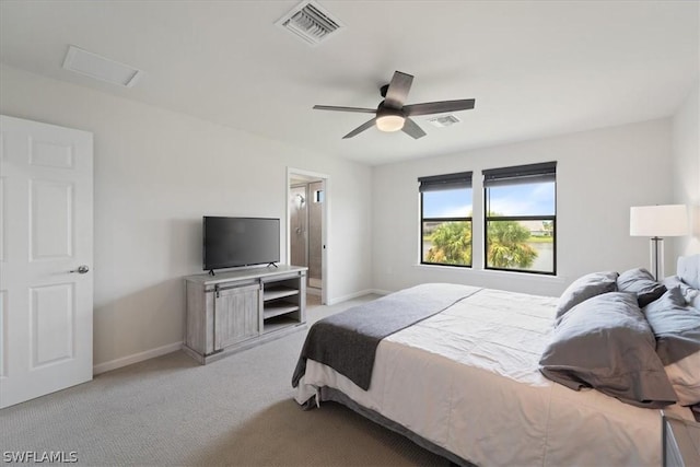 bedroom with carpet, visible vents, and baseboards