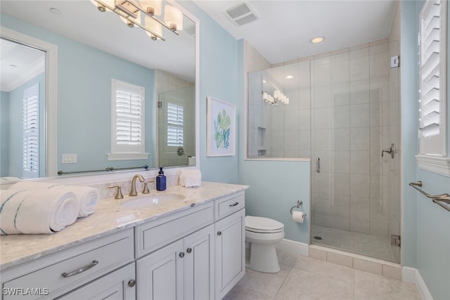 bathroom with an enclosed shower, vanity, tile patterned floors, and toilet