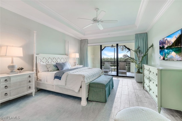 bedroom featuring crown molding, ceiling fan, access to exterior, and a raised ceiling