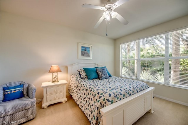 bedroom with light carpet and ceiling fan