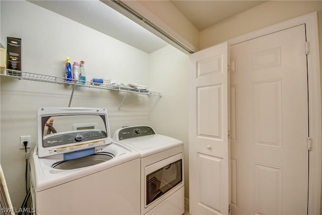 washroom with washer and clothes dryer