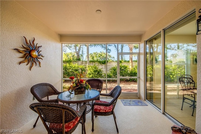 sunroom / solarium featuring a healthy amount of sunlight