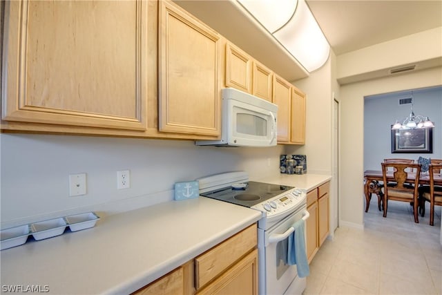 kitchen with an inviting chandelier, white appliances, decorative light fixtures, and light brown cabinets