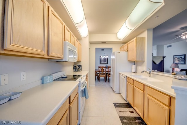 kitchen with ceiling fan, sink, light brown cabinetry, and white appliances