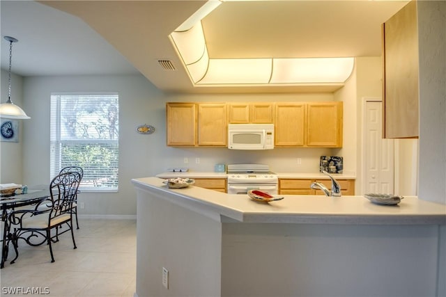 kitchen featuring light brown cabinetry, sink, white appliances, and pendant lighting