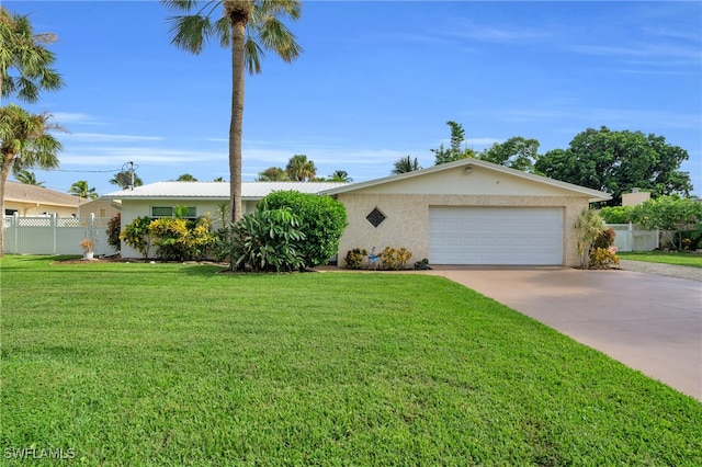 ranch-style home with a front yard and a garage