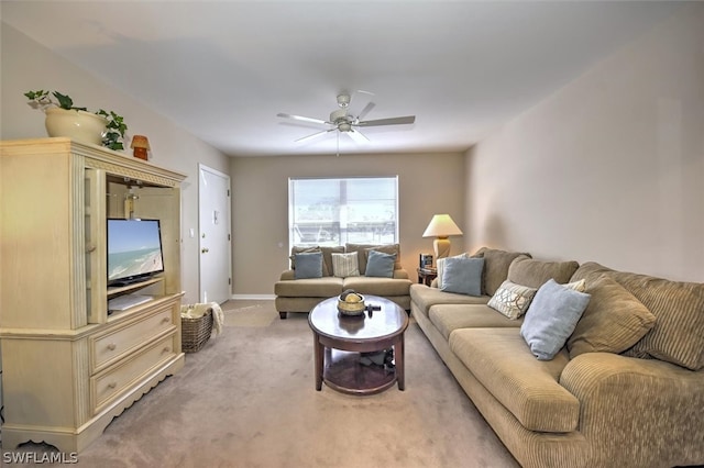 carpeted living room featuring ceiling fan