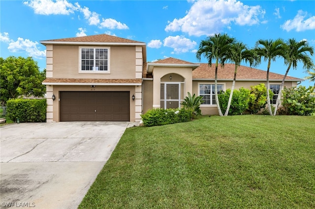 view of front of home with a garage and a front lawn