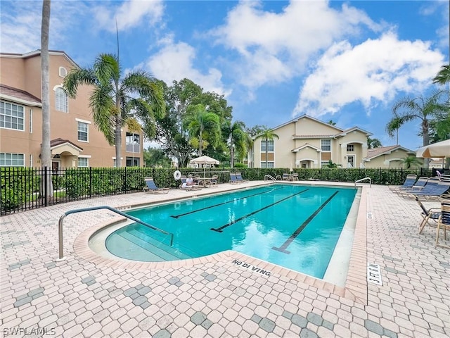 view of swimming pool featuring a patio