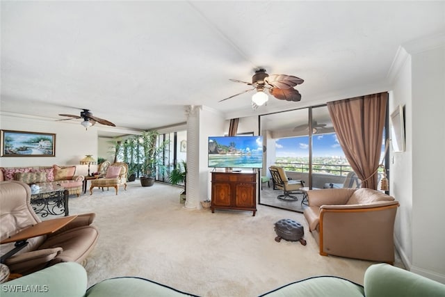 living room featuring ceiling fan, carpet, and ornamental molding