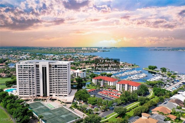 aerial view at dusk with a water view