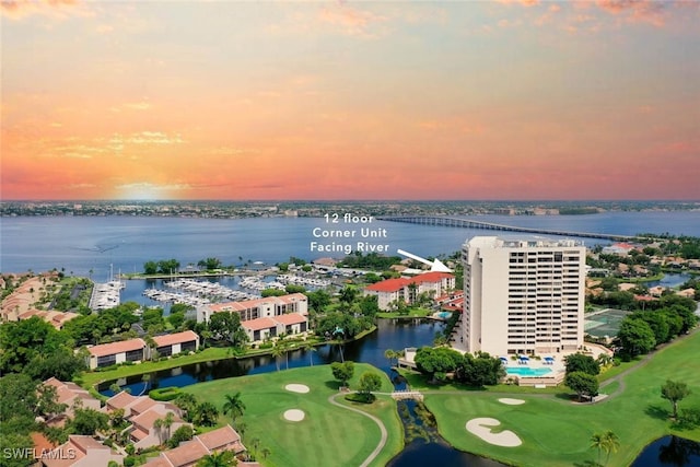 aerial view at dusk with a water view