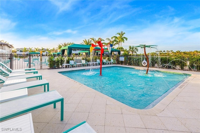 view of pool with a patio area and pool water feature