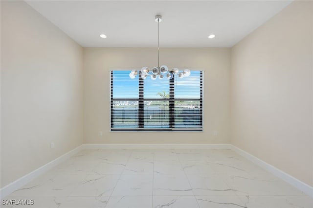 unfurnished dining area featuring a notable chandelier