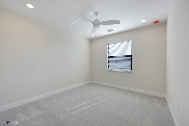 carpeted empty room featuring ceiling fan