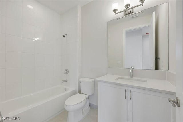 full bathroom with tile patterned floors, toilet, vanity, and tiled shower / bath