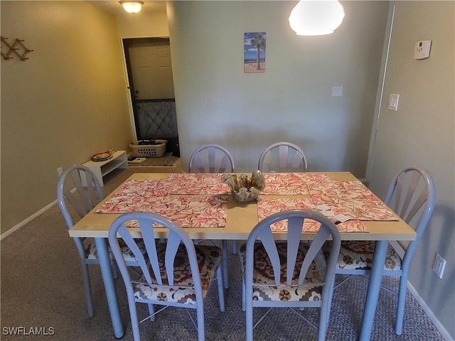 dining room featuring carpet