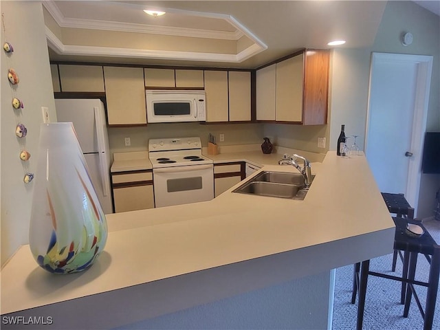 kitchen with crown molding, sink, kitchen peninsula, and white appliances