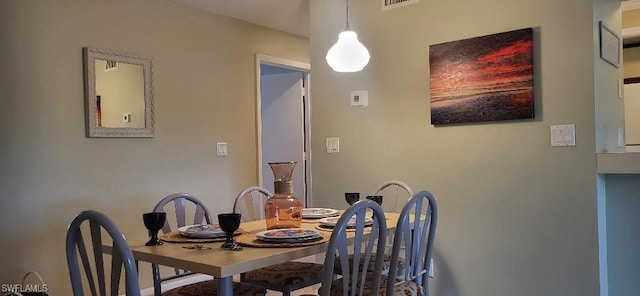 dining area featuring visible vents