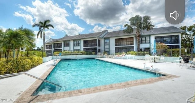 pool featuring a patio and fence