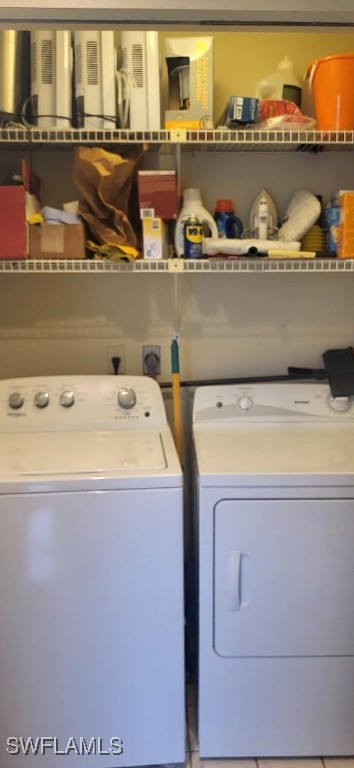 clothes washing area with laundry area and washing machine and clothes dryer