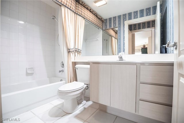 full bathroom with tile patterned floors, shower / bath combo with shower curtain, vanity, and toilet