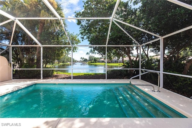 view of pool featuring a lanai, a water view, and a patio