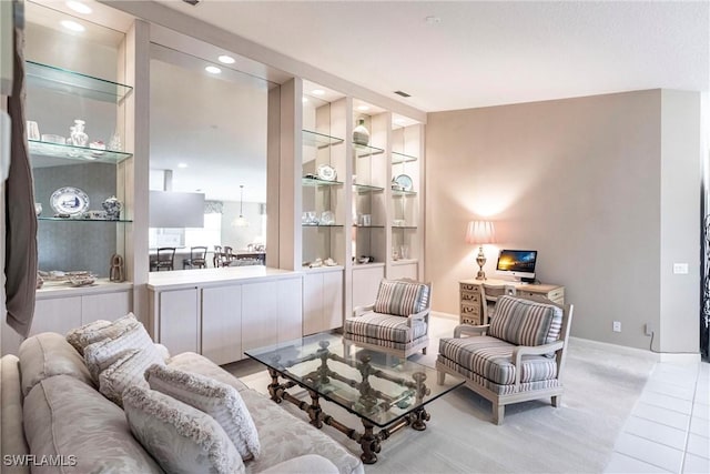 sitting room featuring built in shelves