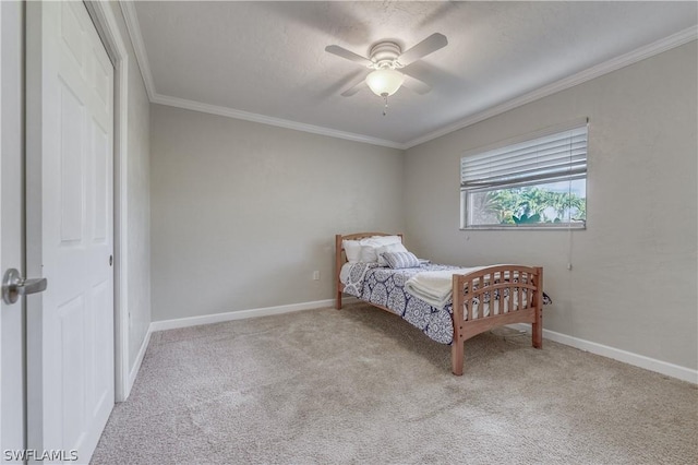 carpeted bedroom featuring ornamental molding, a textured ceiling, and ceiling fan