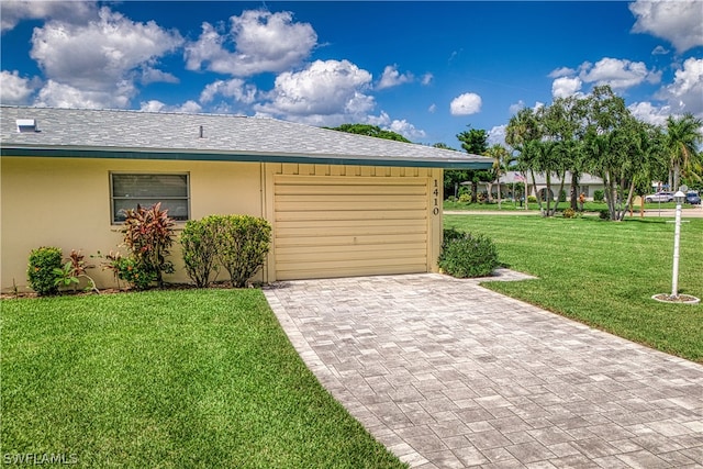 garage with a yard