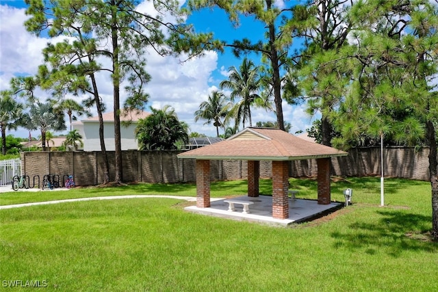 view of home's community featuring a patio and a yard