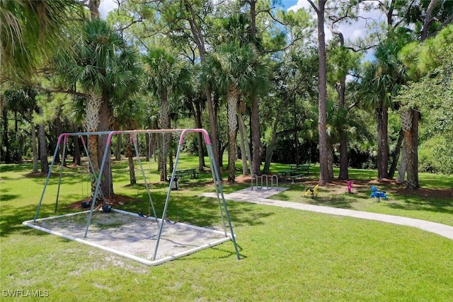 view of jungle gym featuring a lawn