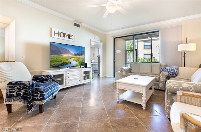 tiled living area with visible vents, baseboards, ceiling fan, and ornamental molding