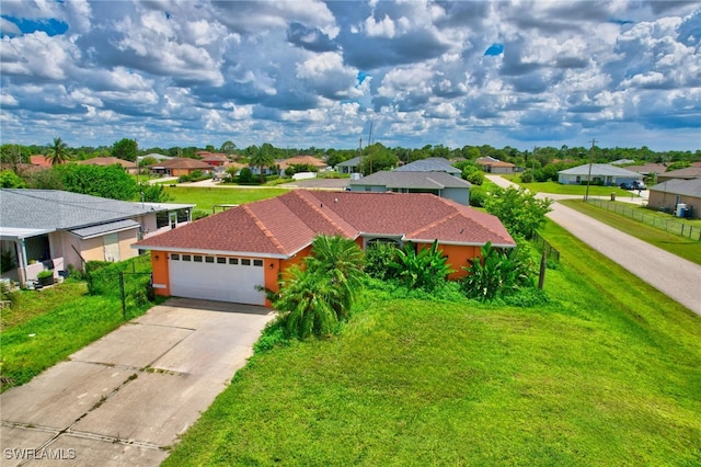 view of front facade with a garage and a front lawn