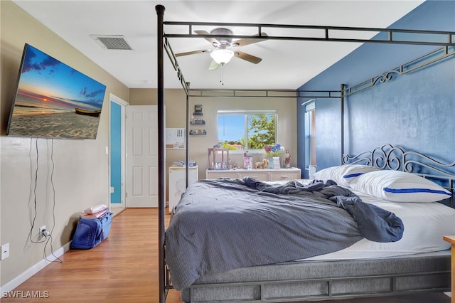 bedroom with wood-type flooring and ceiling fan