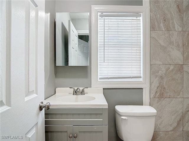 bathroom with vanity and toilet