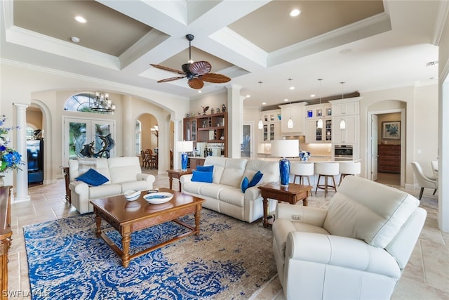 living room featuring french doors, coffered ceiling, ceiling fan with notable chandelier, crown molding, and beam ceiling