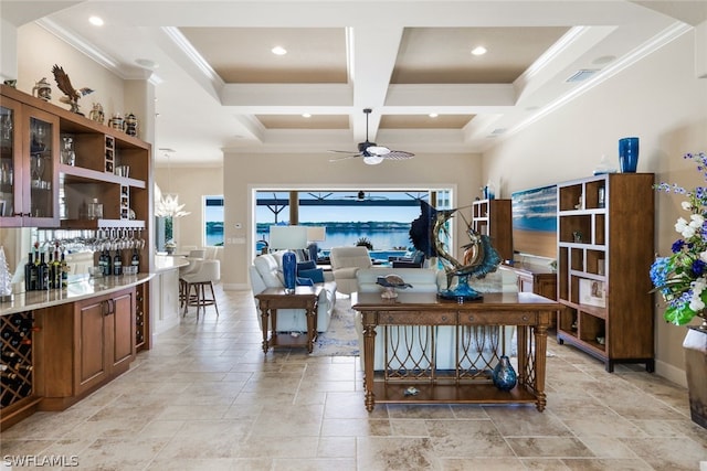 living room featuring ceiling fan, beamed ceiling, coffered ceiling, and ornamental molding