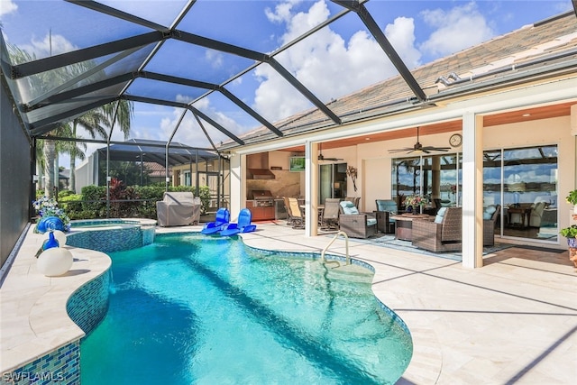 view of swimming pool featuring an in ground hot tub, area for grilling, a lanai, ceiling fan, and a patio