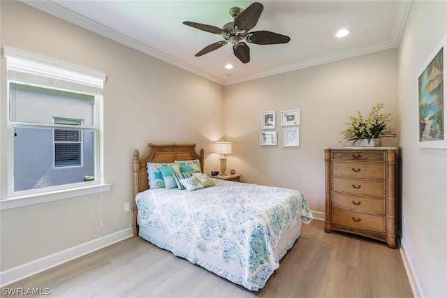 bedroom featuring ceiling fan, crown molding, and light wood-type flooring