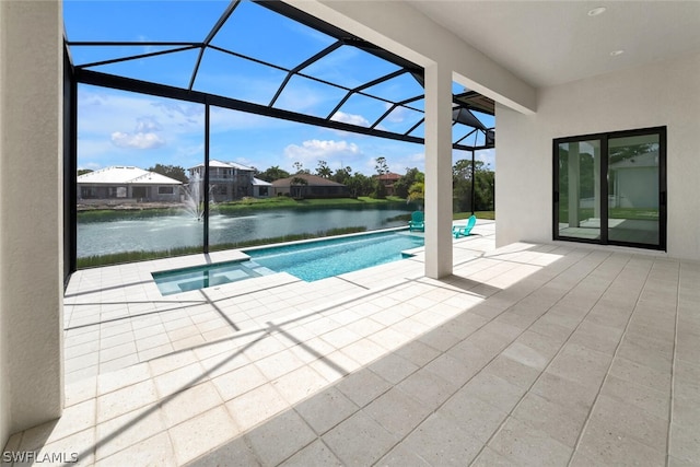 view of swimming pool featuring a water view, pool water feature, a lanai, and a patio