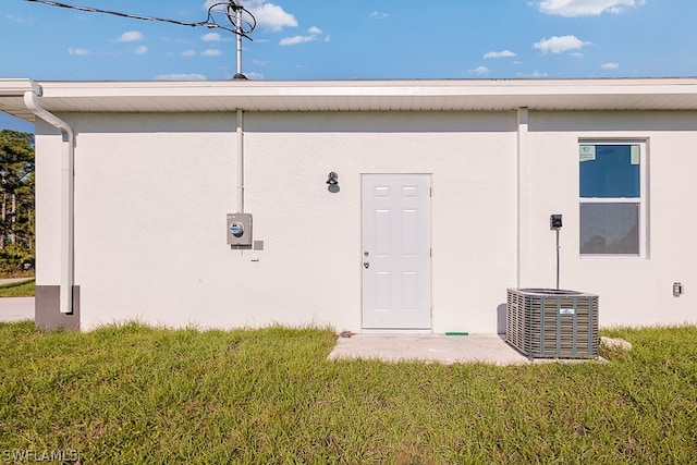 back of property with a lawn