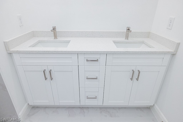 bathroom featuring tile patterned flooring and dual vanity