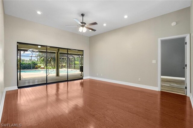 spare room with wood-type flooring and ceiling fan