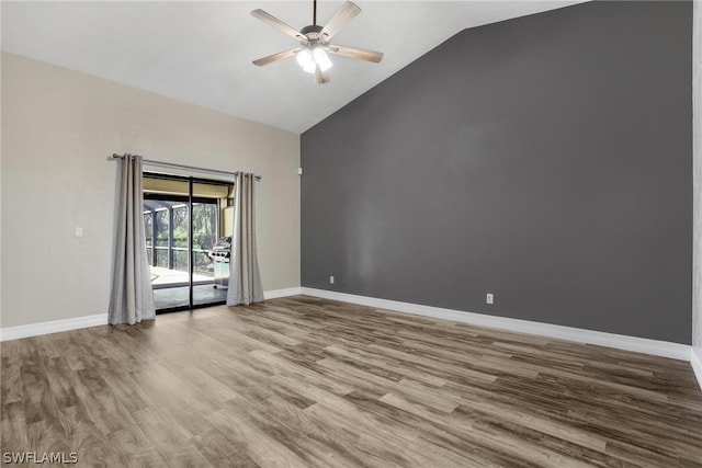 unfurnished room with vaulted ceiling, hardwood / wood-style floors, and ceiling fan