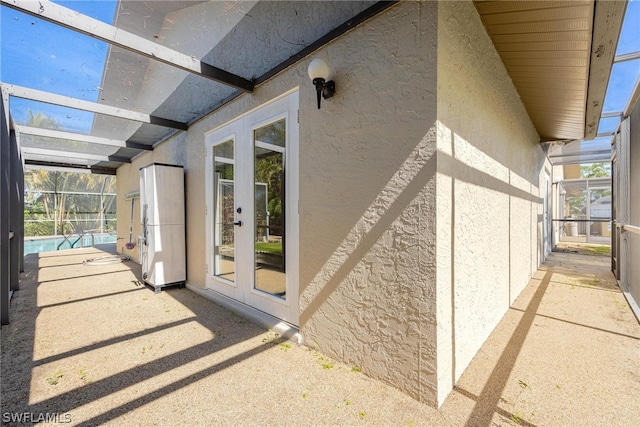 exterior space with a lanai, french doors, and a patio area