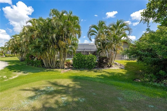 view of yard with a lanai